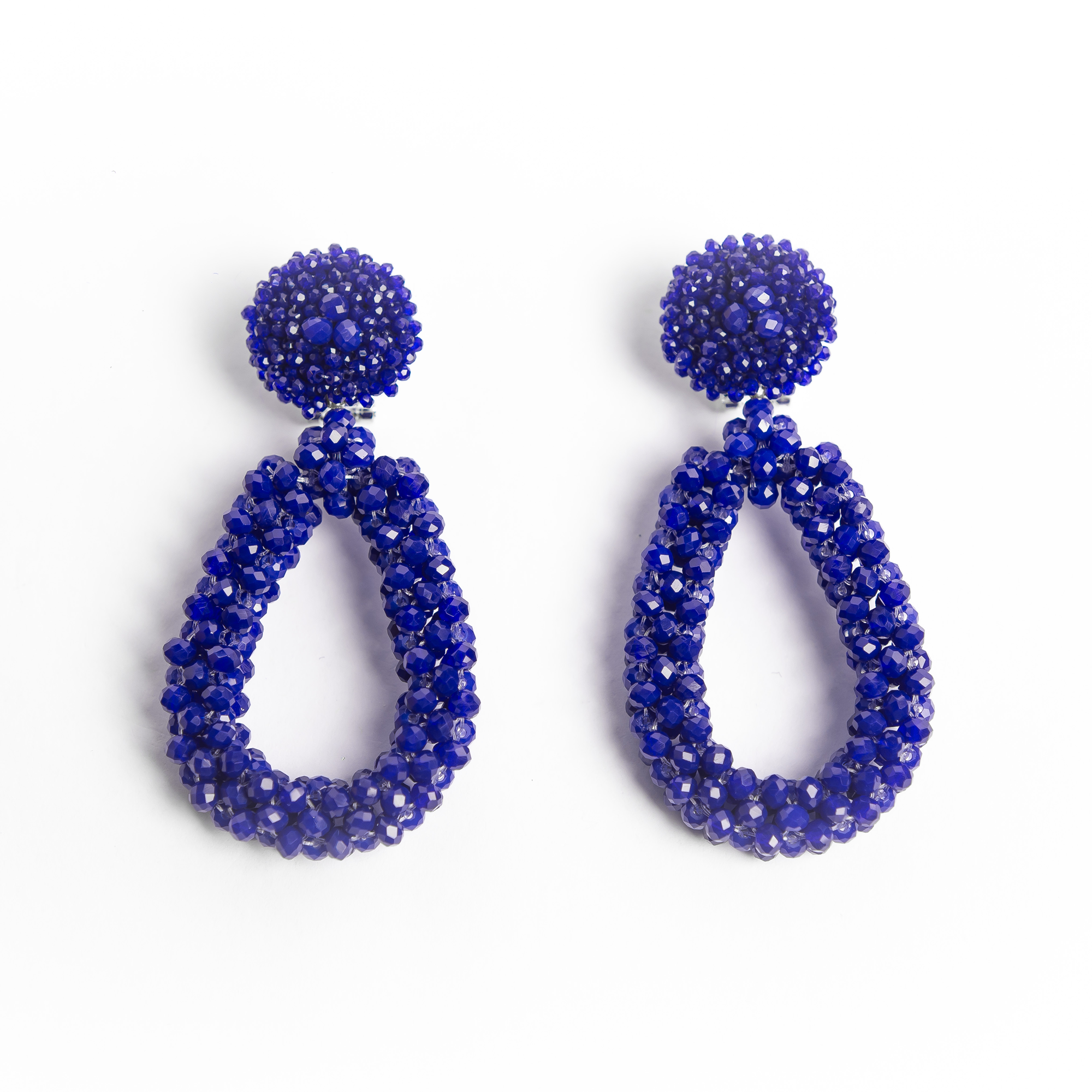 Pair of blue beaded earrings on a white background